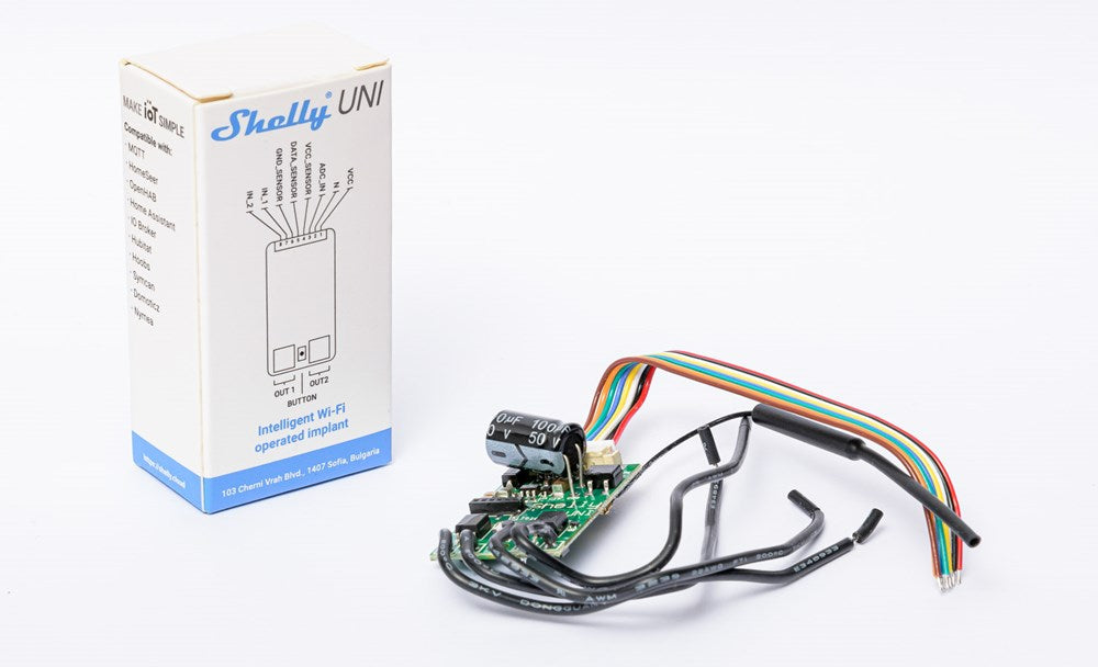 Universal Smart Implant for smart automation, enabling Z-Wave, Zigbee, or Wi-Fi control of sensors, alarms, and electrical circuits.