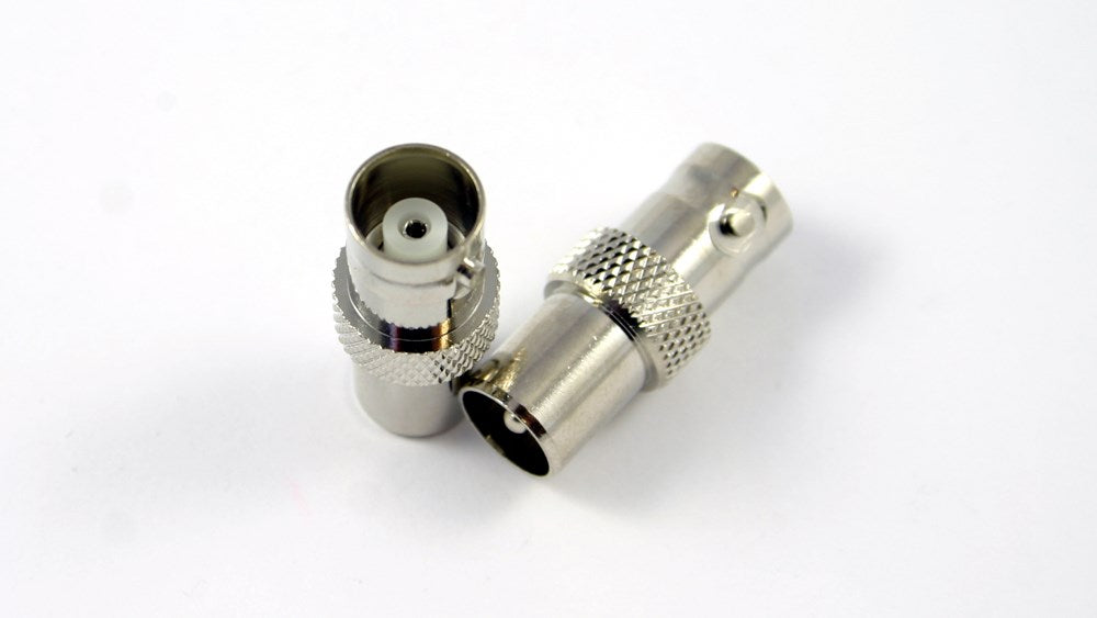 Close-up of a nickel-plated BNC Socket to PAL Plug Adapter, ideal for connecting coaxial cables in AV and surveillance systems.