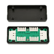 Electronic component with green circuit board and black housing on a white background